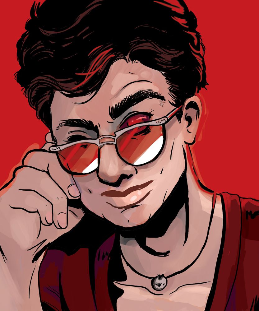 A man with red sunglasses, tipping them down his nose as he looks over them at you. 