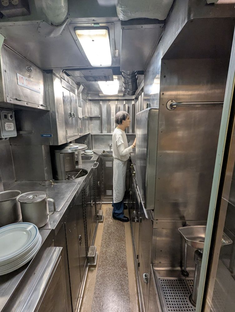 Mannequin chef in a submarine kitchen