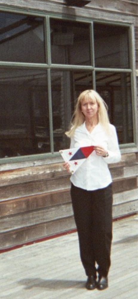 A sailor probably displaying her yacht club flag.