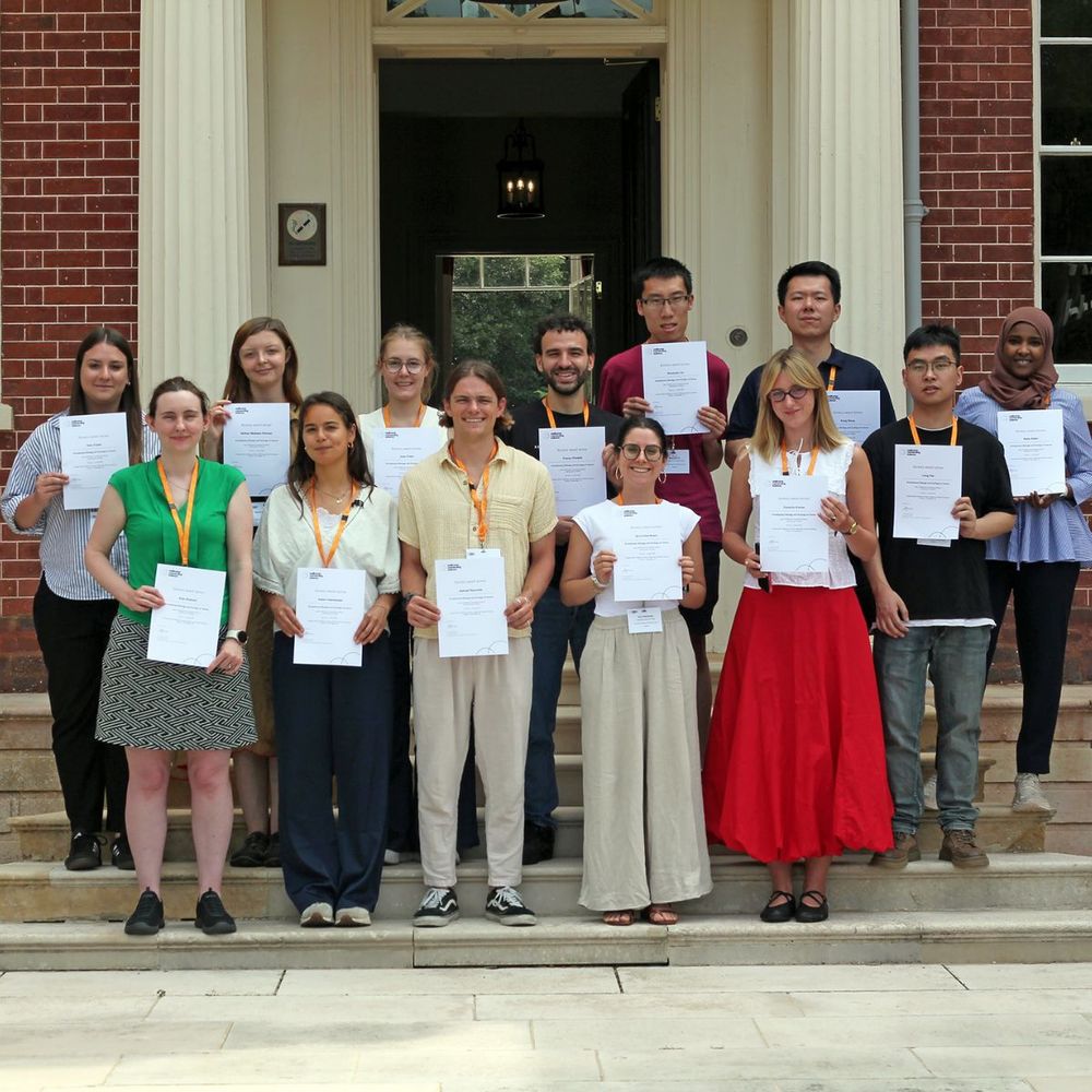Bursary winners of the Evolutionary Biology and Ecology of Cancer course smiling proudly on the Hinxton Hall Conference Centre stairs.