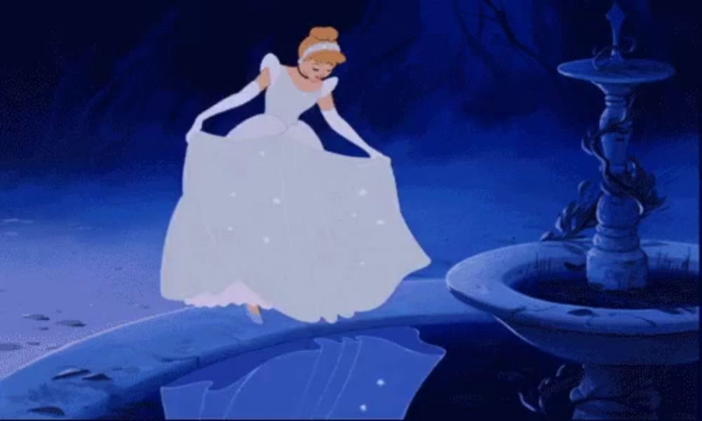 cinderella is dancing in front of a fountain with a blue background