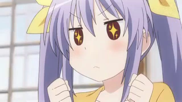 a girl with purple hair and yellow bows is making a funny face with her fist in the air .