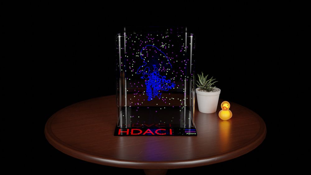 3D rendering of a wooden table holding a glowing rubber duck, a small potted succulent, and a simple clear display cube holding a model of the HDAC1 protein with ions dispersed randomly around it.