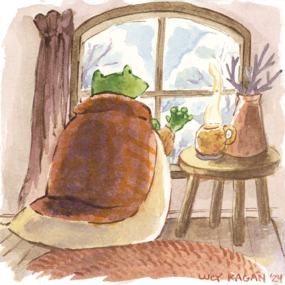 A watercolor illustration: A frog gazes out the window at a winter landscape, their hand touching the cold pane. They are wrapped in a thick comforter, plaid red and orange with a white border, and a steaming hot mug sits on the simple side table next to them, along with an arrangement of dry branches. 