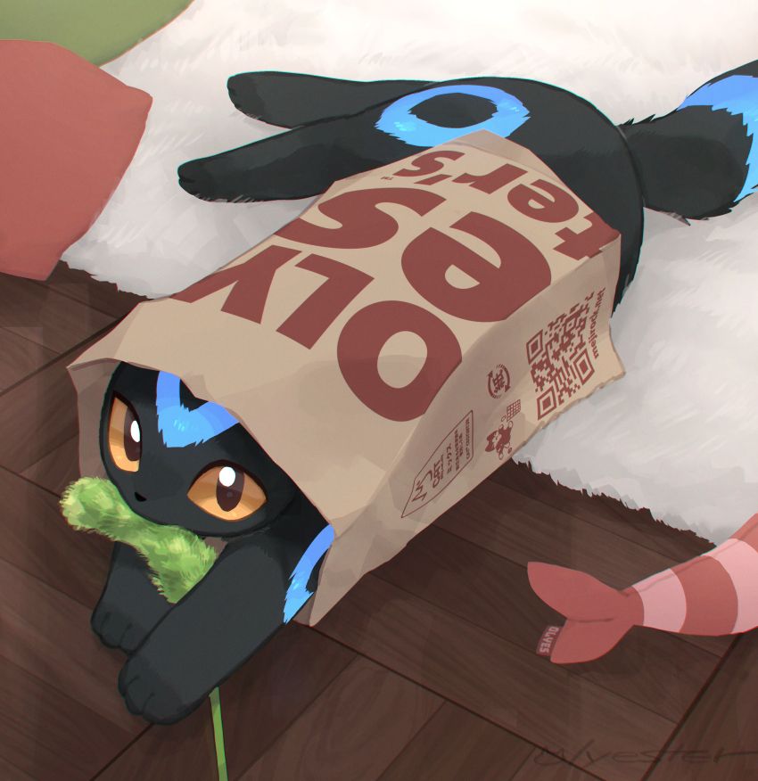 A shiny umbreon lying through the paper bag. It just caught a toy.