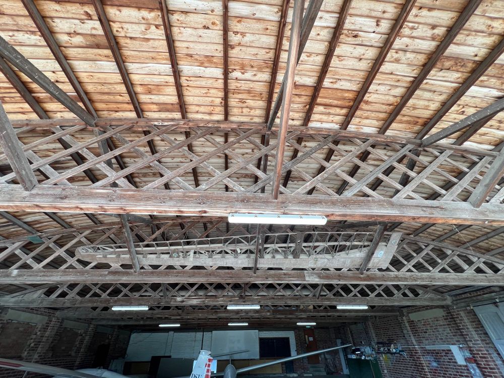 Roof of aircraft hangar. Made of wooden trusses called a Belfast Truss. Over 100 years old. 