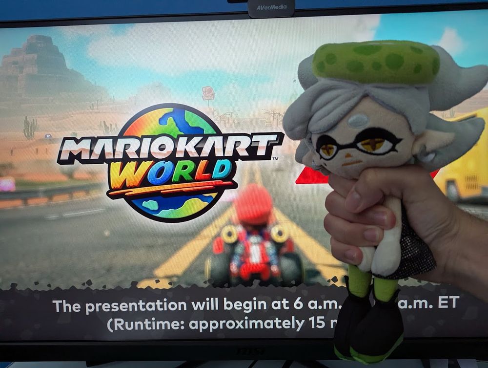 I'm watching the Mario Kart World Direct; I'm aggresively grabbing Marie Plush and holding her in front of my monitor.