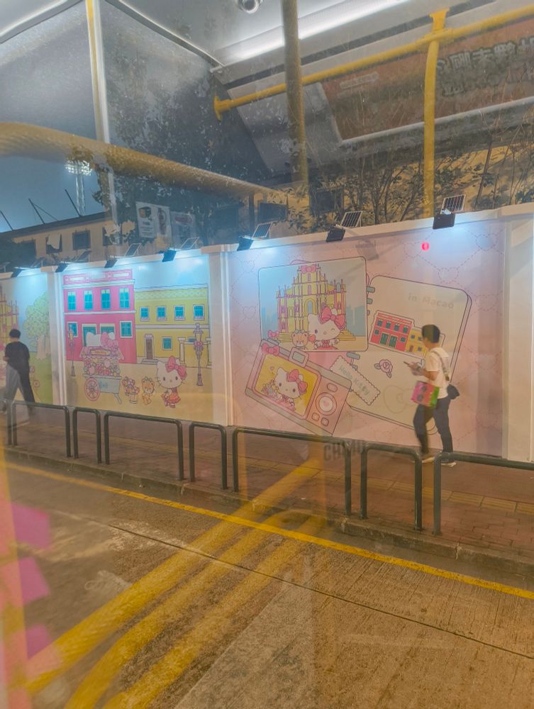 Hello kitty pictures on a wall with Macau designs