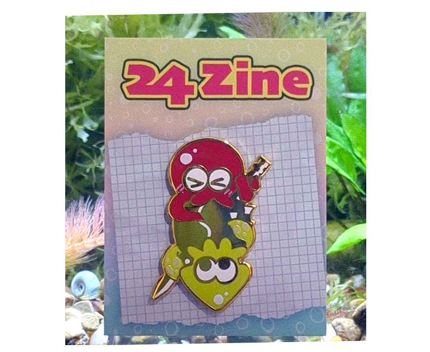 Enamel pin depicting Agent 3 & Agent 8 (squid and octopus form) with the golden toothpick