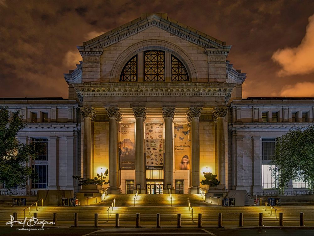 Museum of Natural History exterior building shot of the entrance, lit up in the evening in Washington DC