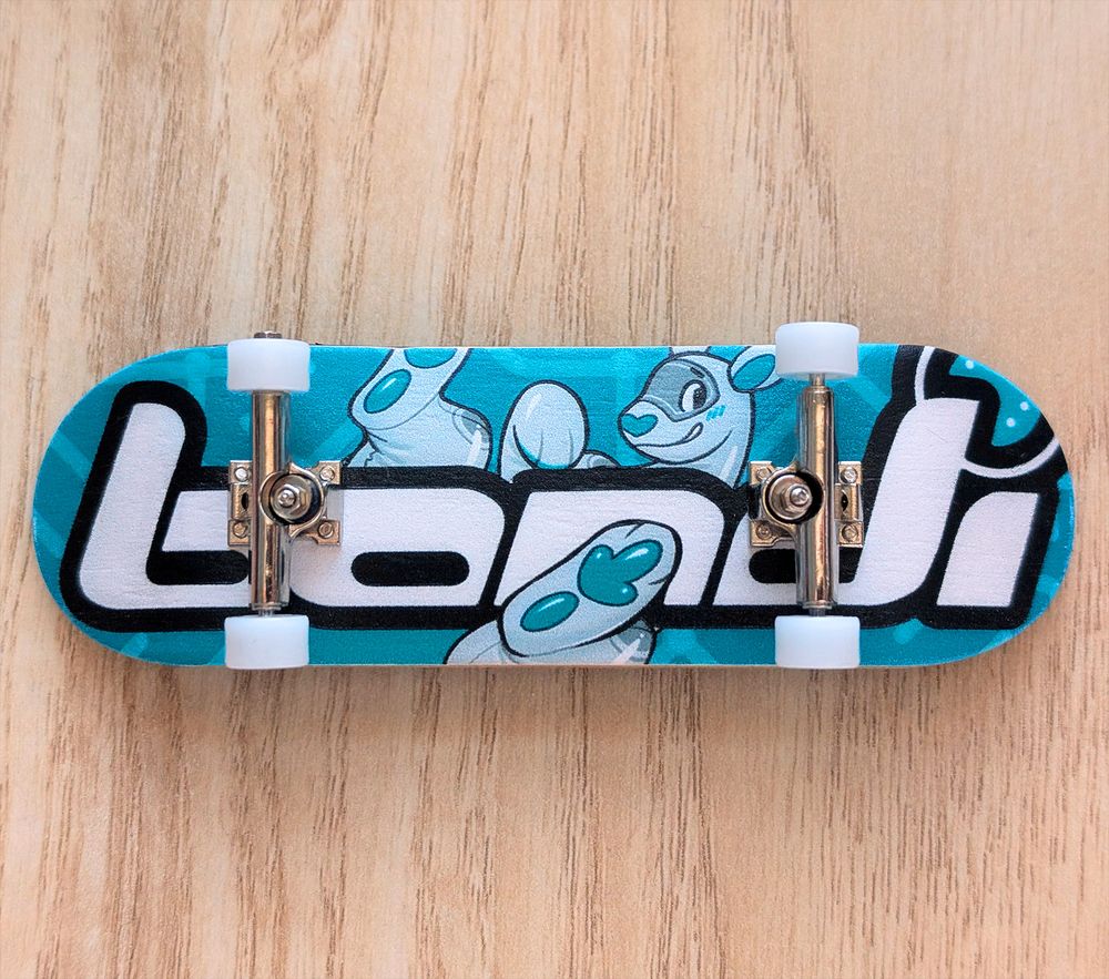 A photo of a wooden fingerboard with furry art by Braeburned printed as the graphic. 