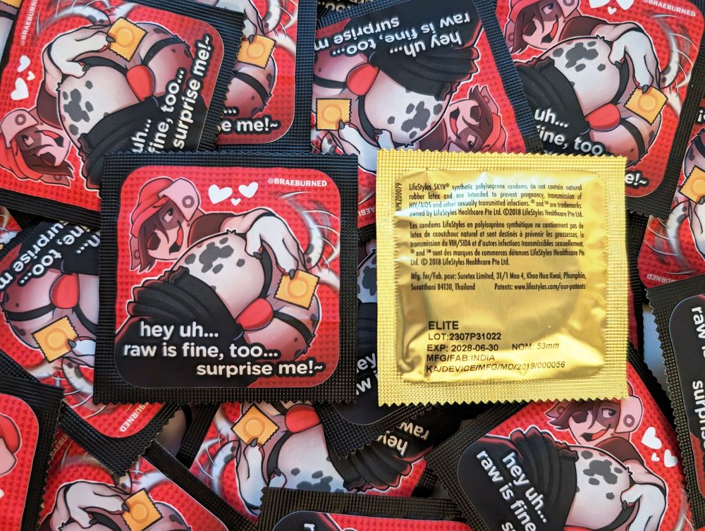 A photo of custom furry condoms by Braeburned, featuring his character Wes. 