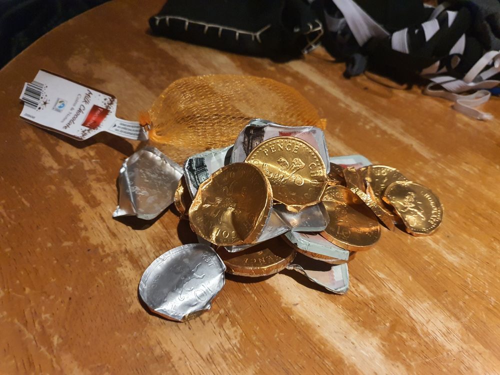 A photo of a bag of chocolate coins sans chocolate. They were tasty.