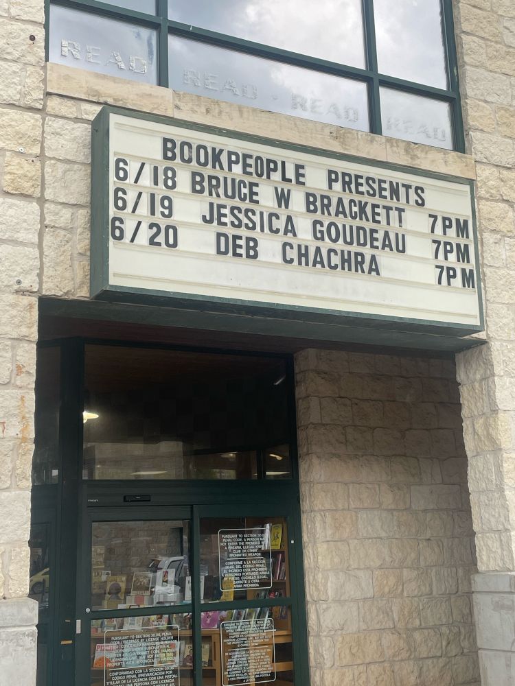 A marquee over a door that reads:
BOOK PEOPLE PRESENTS and information about three events, the third of which is:
06 /20 DEB CHACHRA  7PM