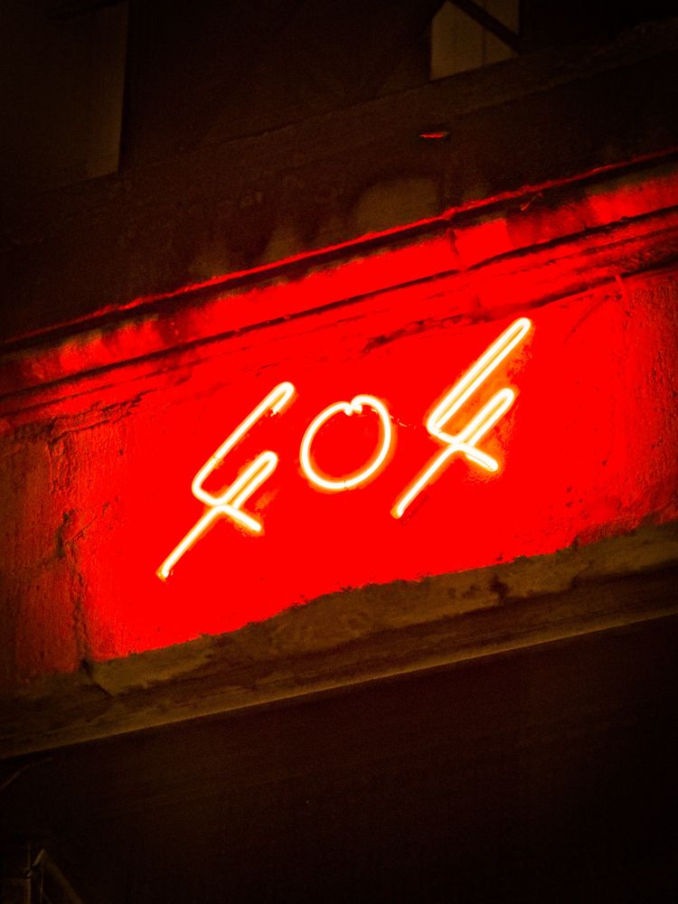 Red neon sign for a bar called 404