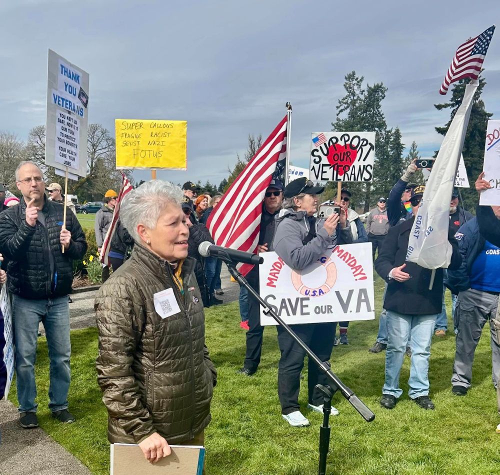 A woman speaking at a protest
