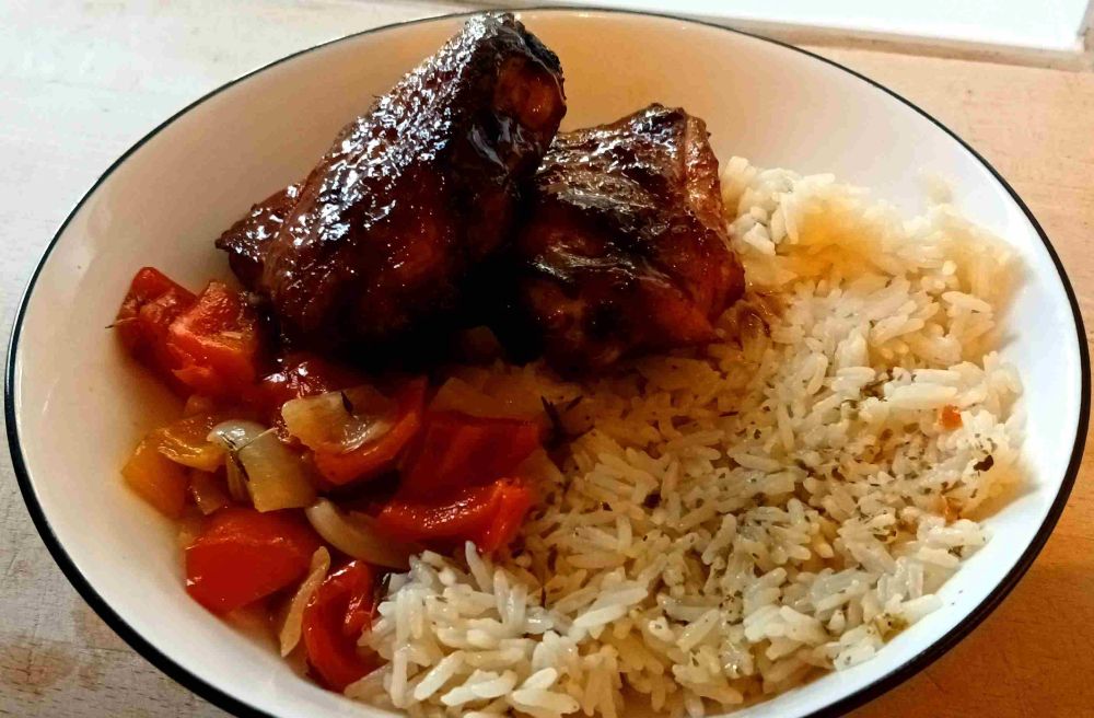Smoked chicken with a BBQ glaze rice and roasted onions and peppers.