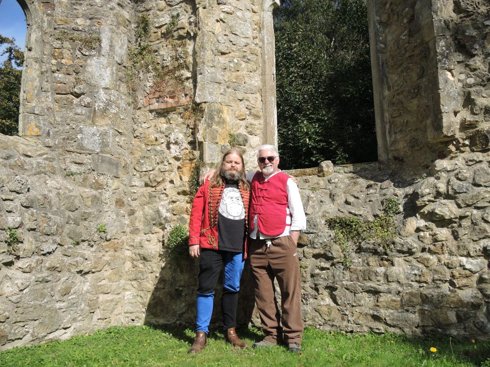 Two writers in a church ruin.