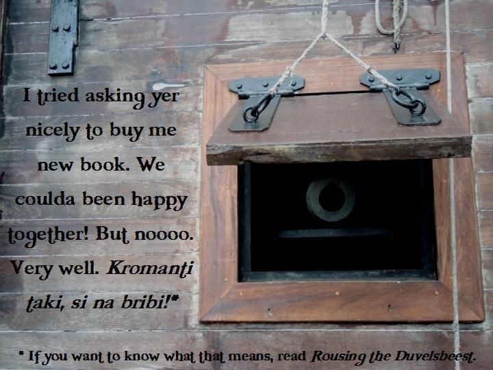 Cannon mouth peering through opened hatch