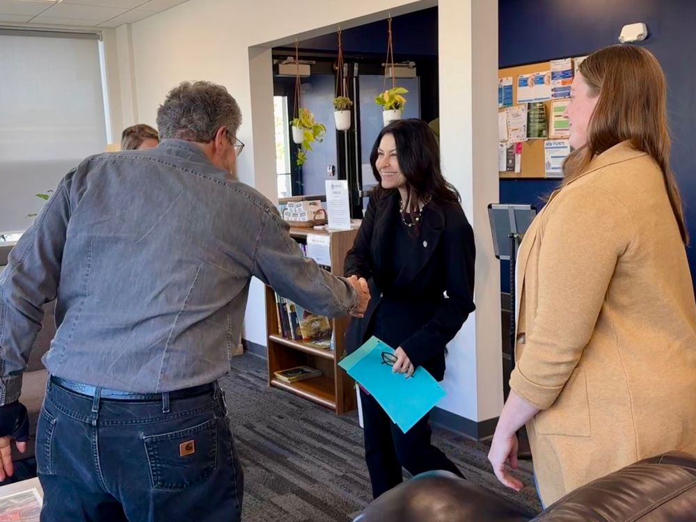 AG Nessel shakes resident’s hand