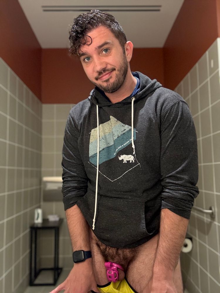 Nathan pulling down jock to show pink cage 