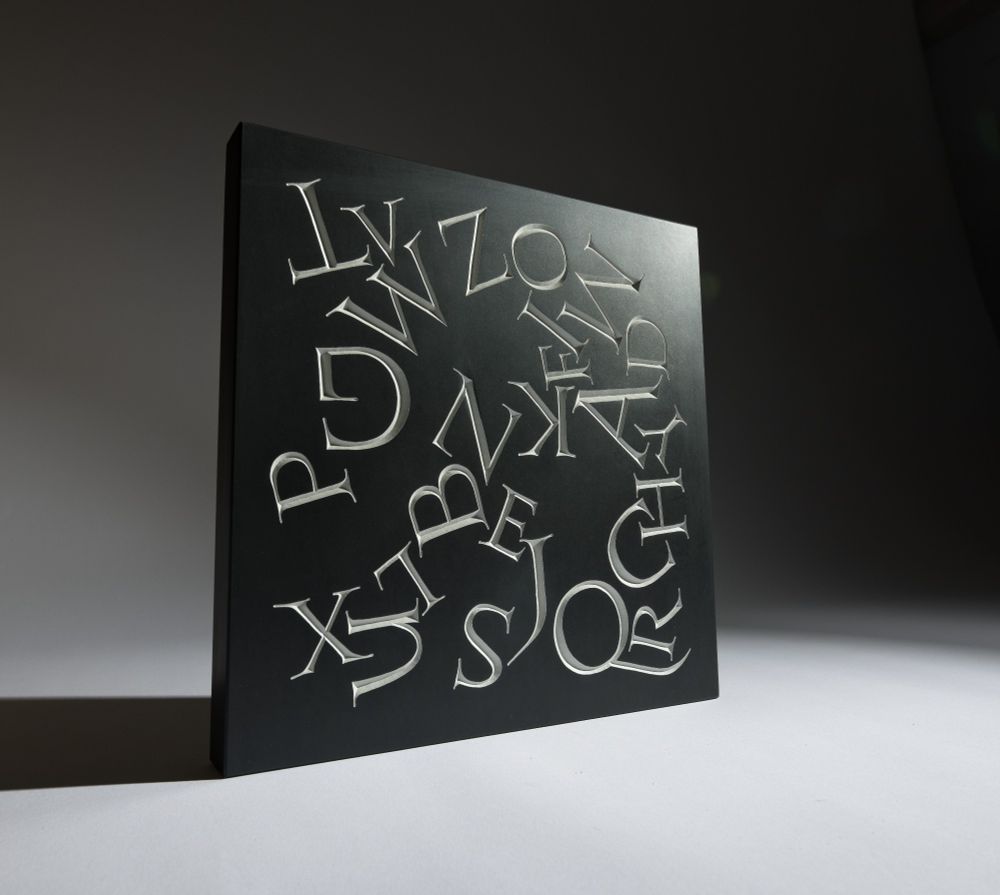 A scattered alphabet. Hand carved #lettering on Welsh slate