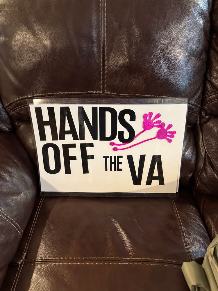 Sign says Hands off the VA