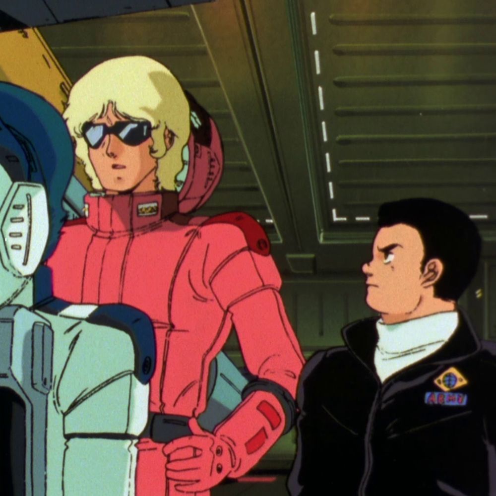 Screenshot from Zeta Gundam, Hayato wordlessly looking up at Quattro and looking especially focused while he speaks with Kamille. 