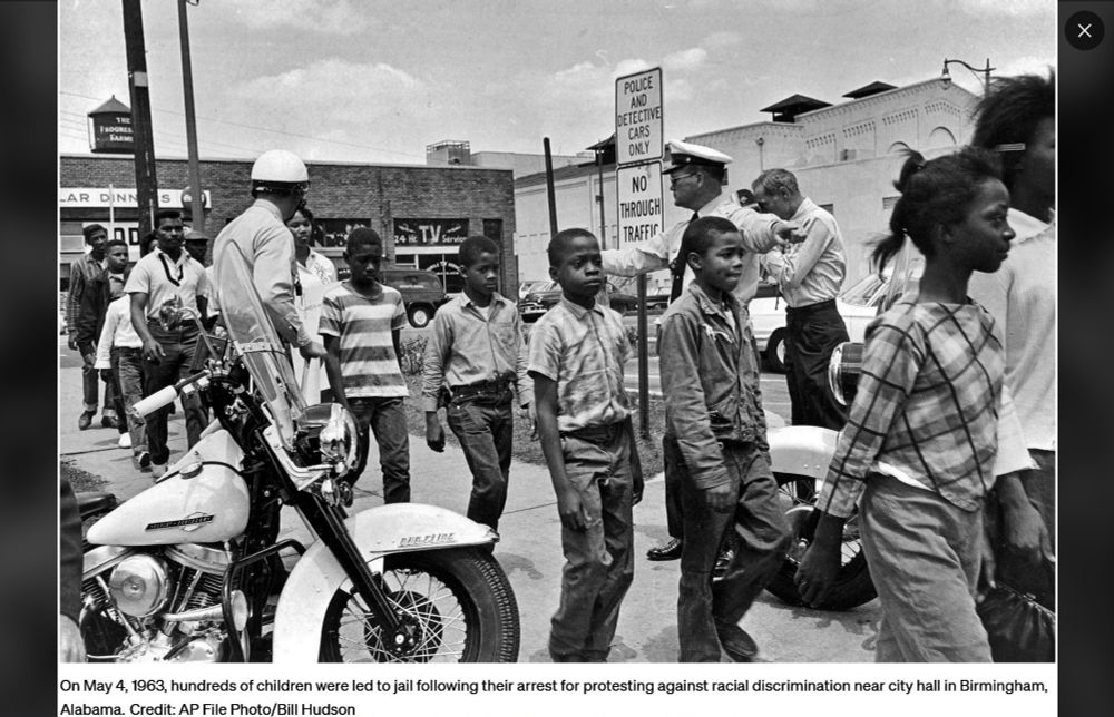 On May 4, 1963, hundreds of children were led to jail following their arrest for protesting against racial discrimination near city hall in Birmingham, Alabama. Picture shows a long line of black children, flanked and directed by police.