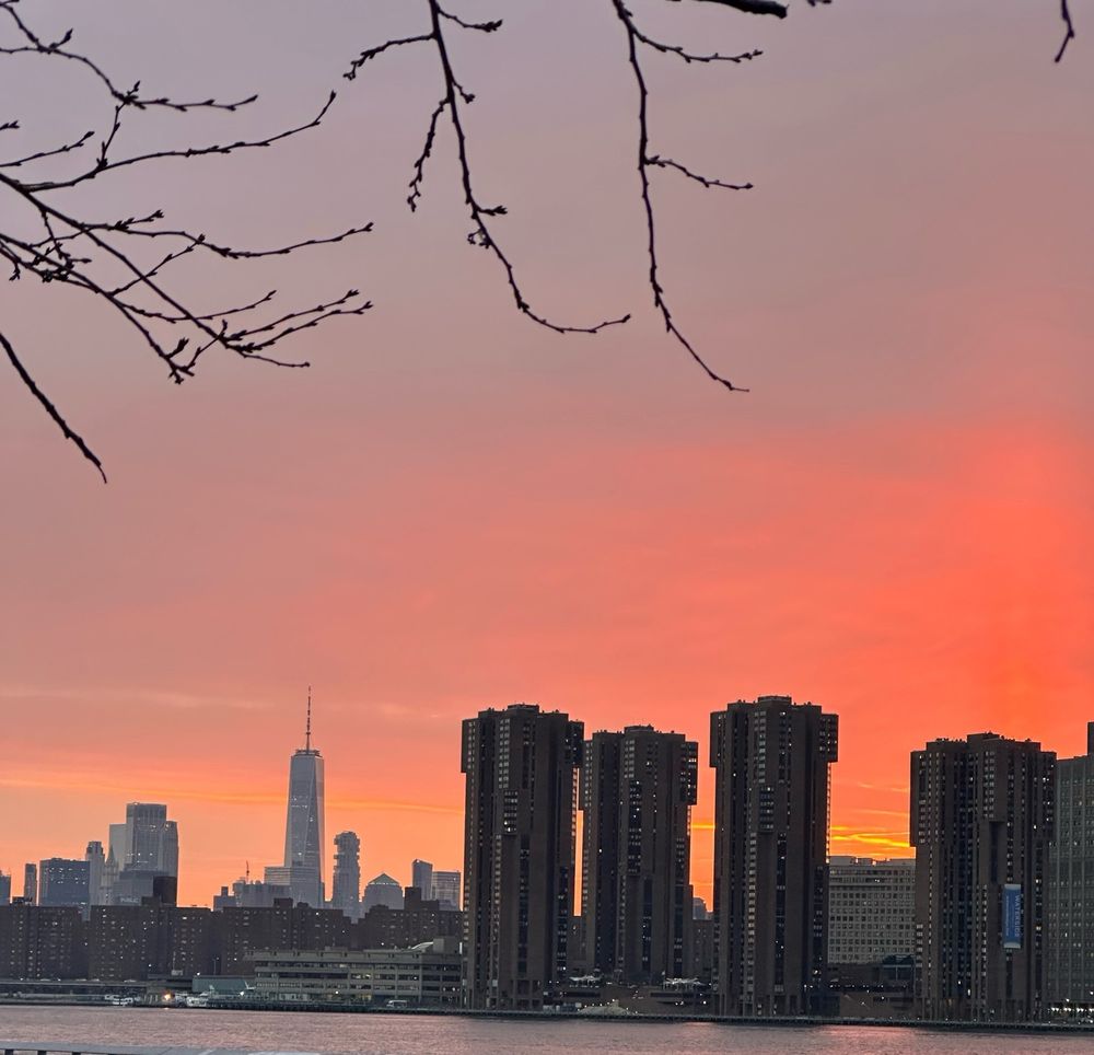 Sunsetting over the East river with the World Trade Center in sight