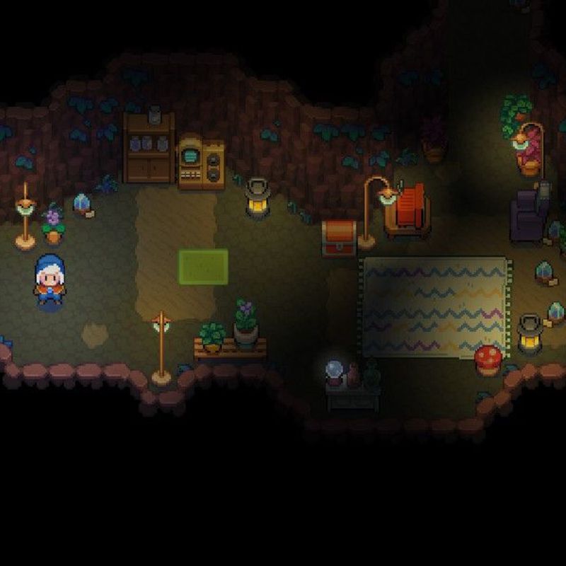 a screenshot from Moonstone Island showing a cozy cave home with warm lighting, rugs, shelves, chests, and crystals
