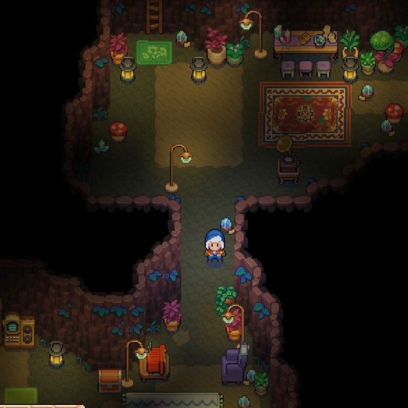 a screenshot from Moonstone Island showing a cozy cave home with warm lighting, rugs, armchairs, and plants