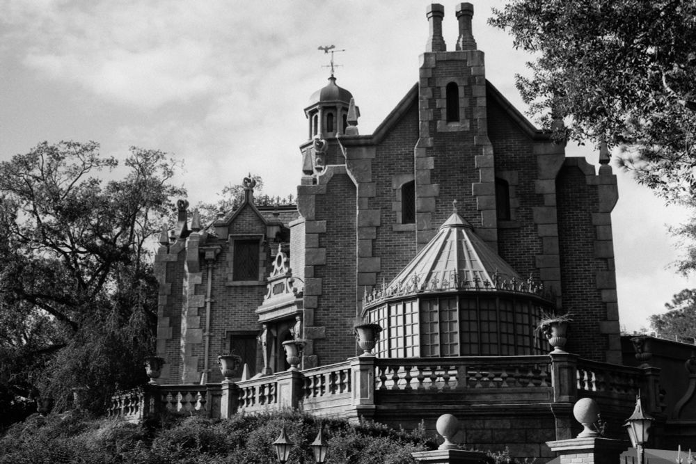 Exterior of the Haunted Mansion in Liberty Square at the Magic Kingdom at Walt Disney World in Orlando, Fl. Shot on Kentmere Pan 100 B&W 35mm film using a Canon AE-1
