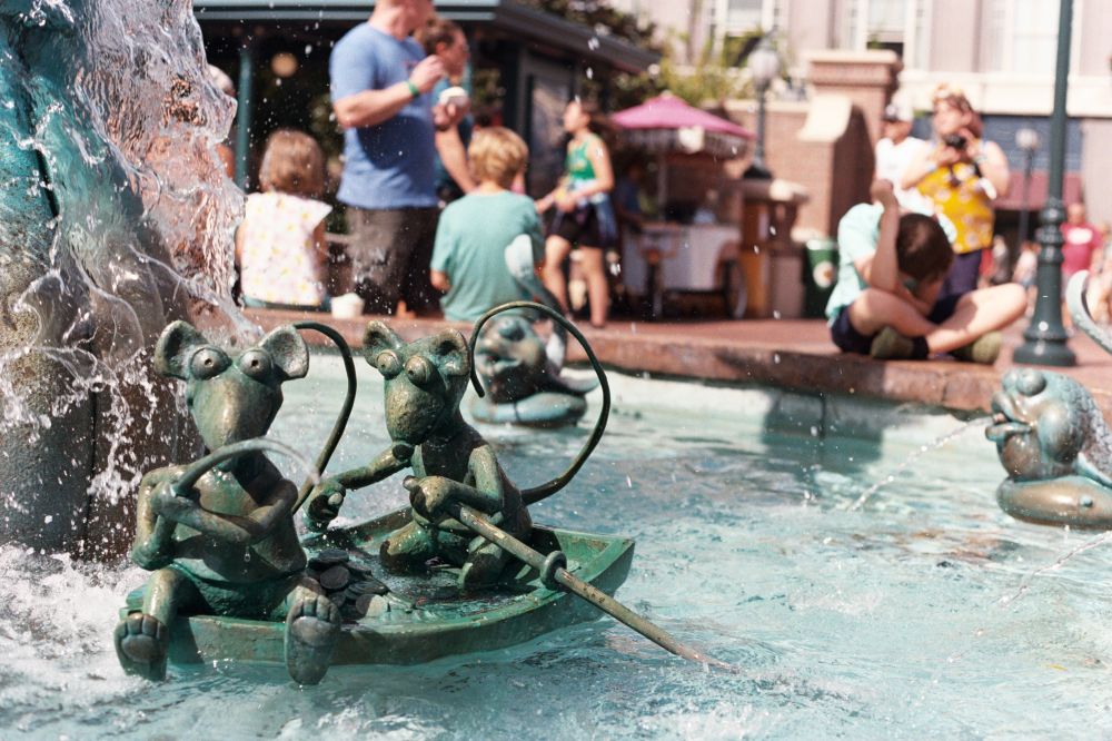 Two rats in a boat. One is using the oars to steer while the other is fishing for coins in the fountain. Located at the fountain in the now defunct Muppets Courtyard at Disney's Hollywood Studios. Shot on Kodak Gold 200 using a Canon AE-1. 