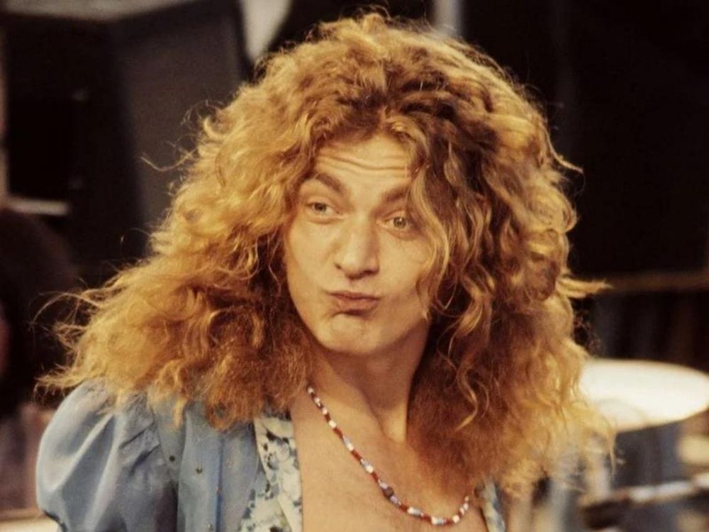 Robert Plant from Led Zeppelin looking sort of pleased.