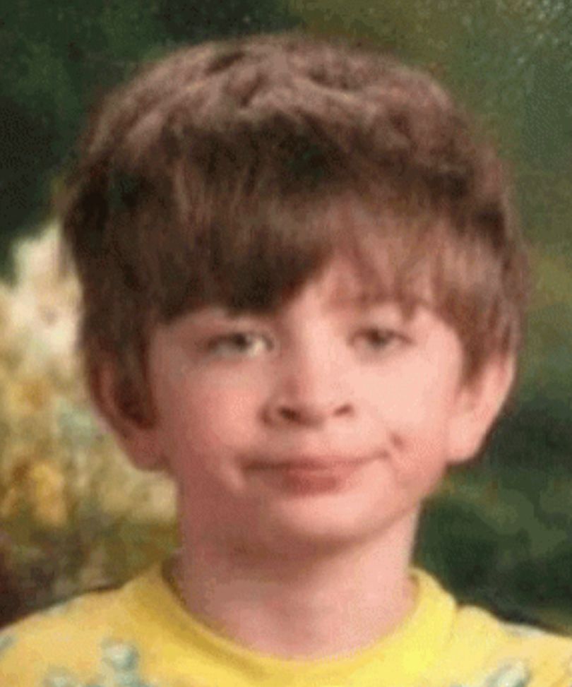 Photo of a kid with brown hair, light skin, and a yellow shirt, giving the camera a fed-up expression.