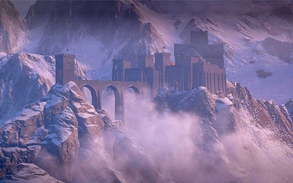 A screenshot of the game dragon age inquisition showing skyhold. It is a dark grey stone castle like structure perched on top of rocky mountains surrounded by snow covered tall peaks.