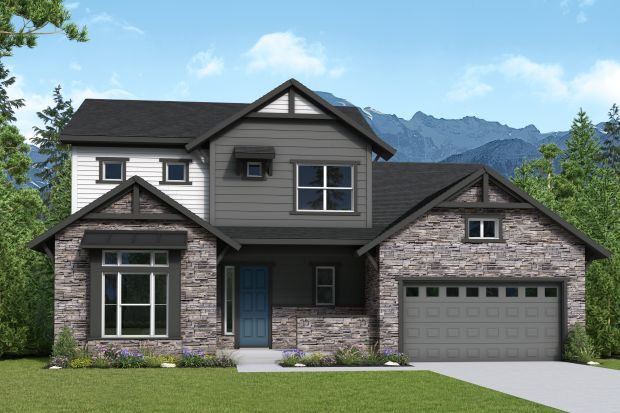 A modern two-story house with gray siding and stone accents, featuring a blue front door and an attached two-car garage. The house is set against a backdrop of mountains and lush greenery. New David Weekley homes are now available in The Aurora Highlands The Vistas in Aurora, CO.