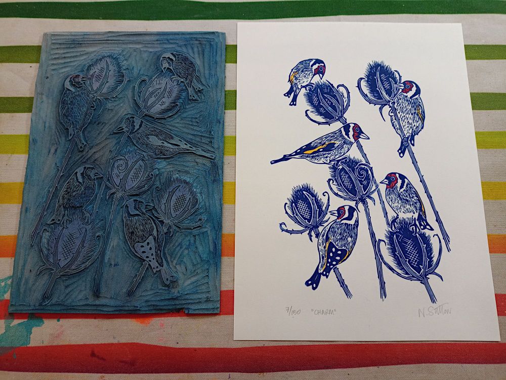 A linoprint of a Charm of Goldfinches, feasting on Teasels