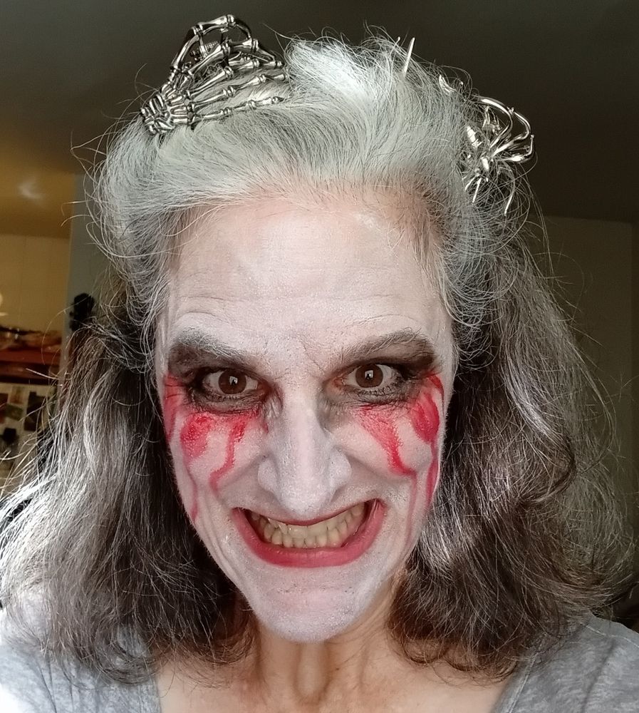 Me in La Lorona makeup with a skeleton hand hair clip and a giant spider hair clip