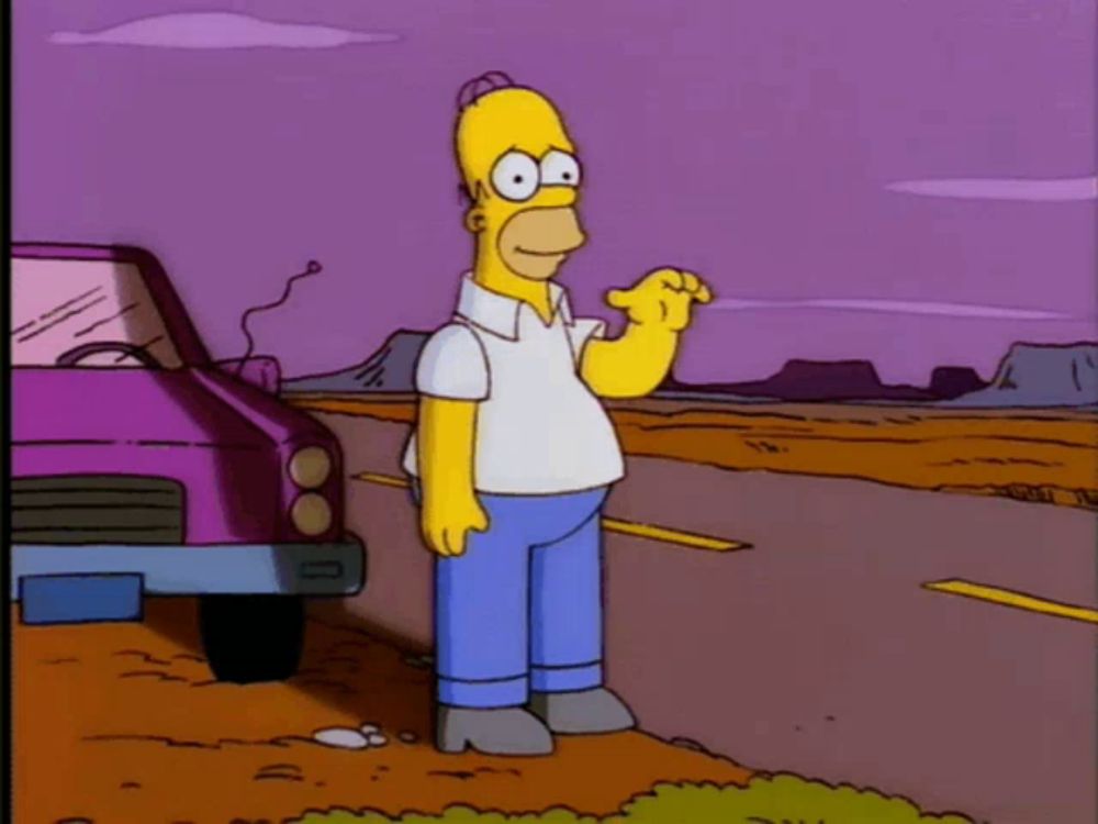 homer simpson is standing on the side of a road