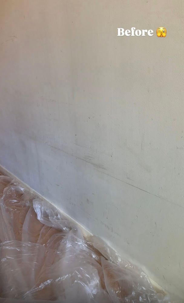 Scuffed old cream painted wall