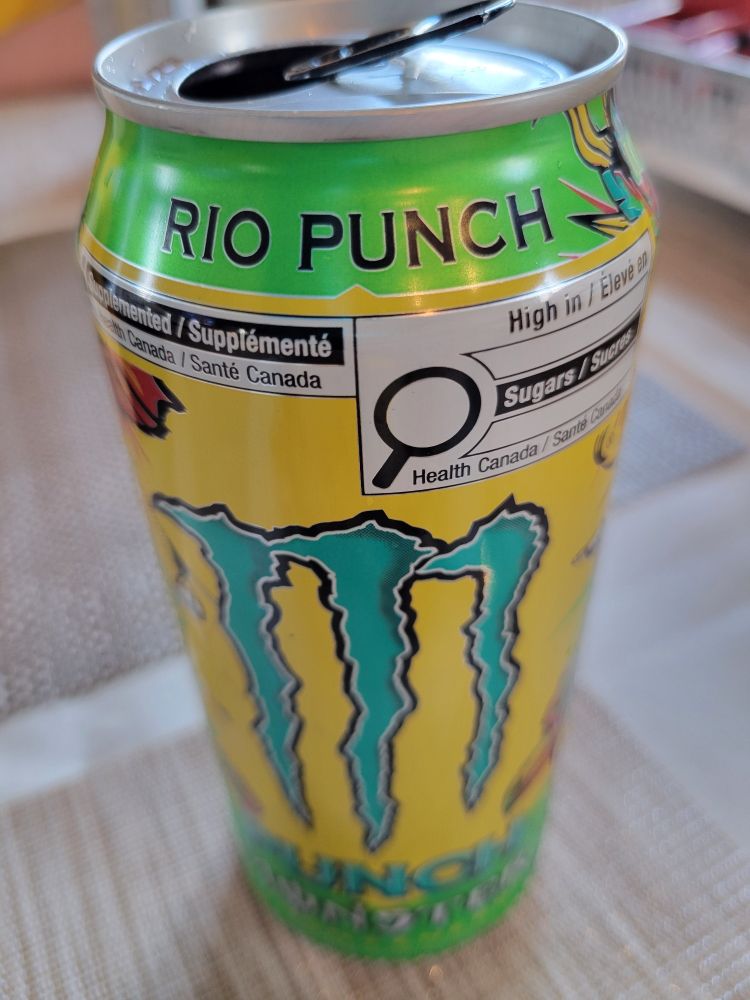 A can of Monster Rio Punch, with a vivid green and yellow label and blue M logo