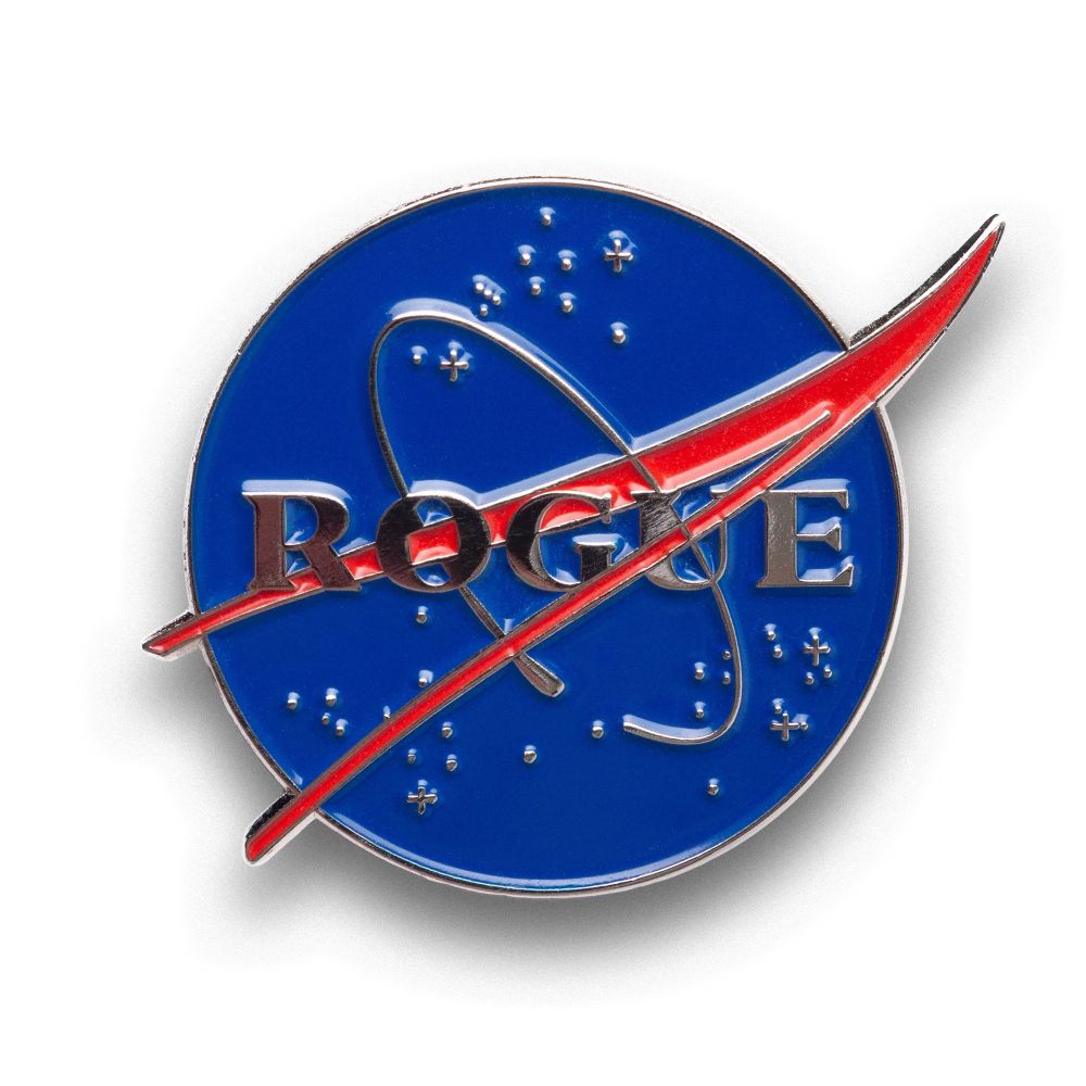 The image features a circular badge with a blue background, the word "ROGUE" in metallic lettering, and a red swoosh design resembling an orbit. There are also small star-like symbols scattered around the background.