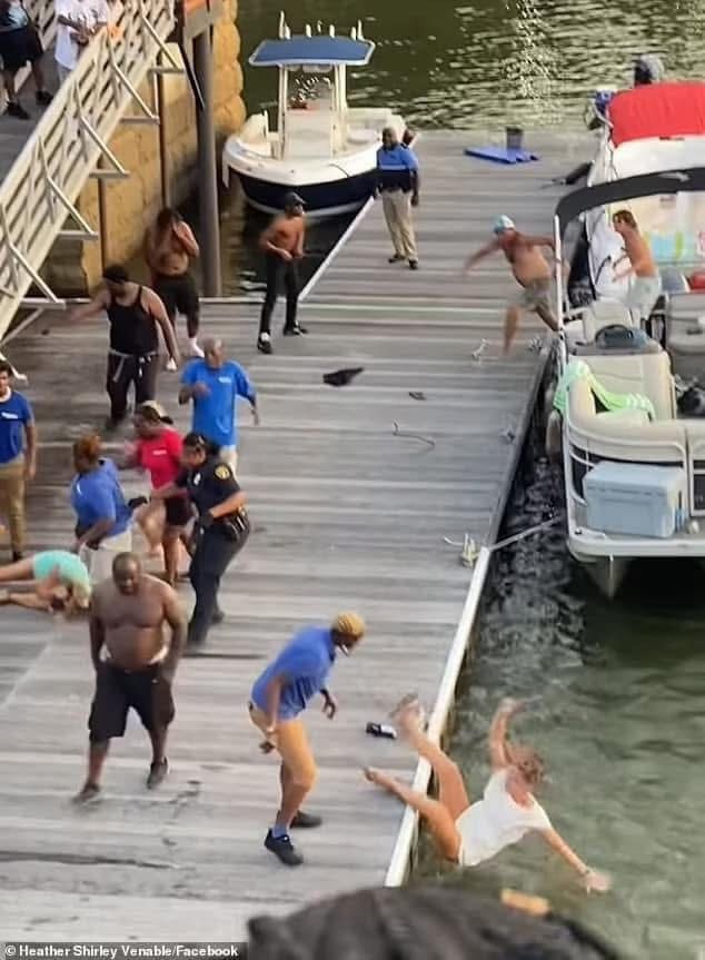 People fighting at the pier in Alabama 