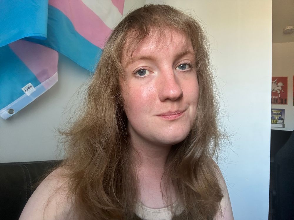 Victoria with very fluffy, face-framing layers and bangs. A soft textured wolf cut, kind of. 