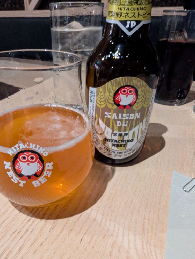 Saison du kitachino nest beer. Glass and bottle