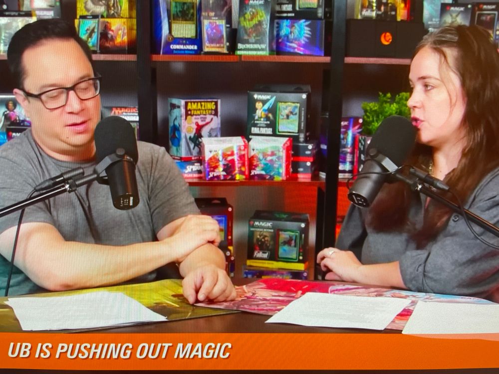 Screen shot of the YouTube channel “The Command Zone”. The words “UB is pushing out Magic” are at the bottom left of the screen. The 2 hosts of the show are on screen with microphones in front of them