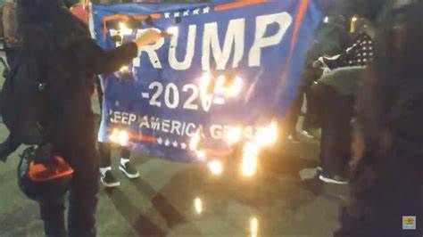 Trump flag getting burned. 