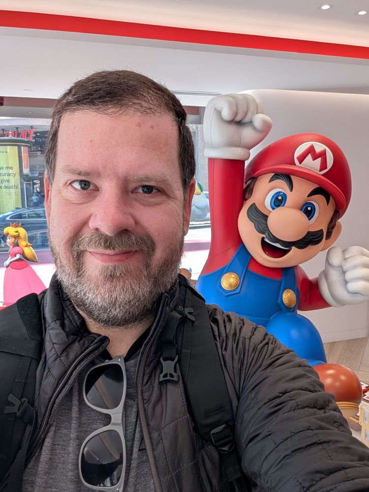 A selfie of me in front of a Mario statue at the Nintendo Store in San Francisco.